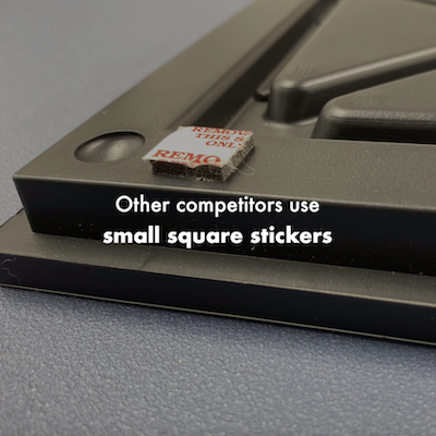 Competitor's tiles are heavier and use small square sticker. More prone to falling